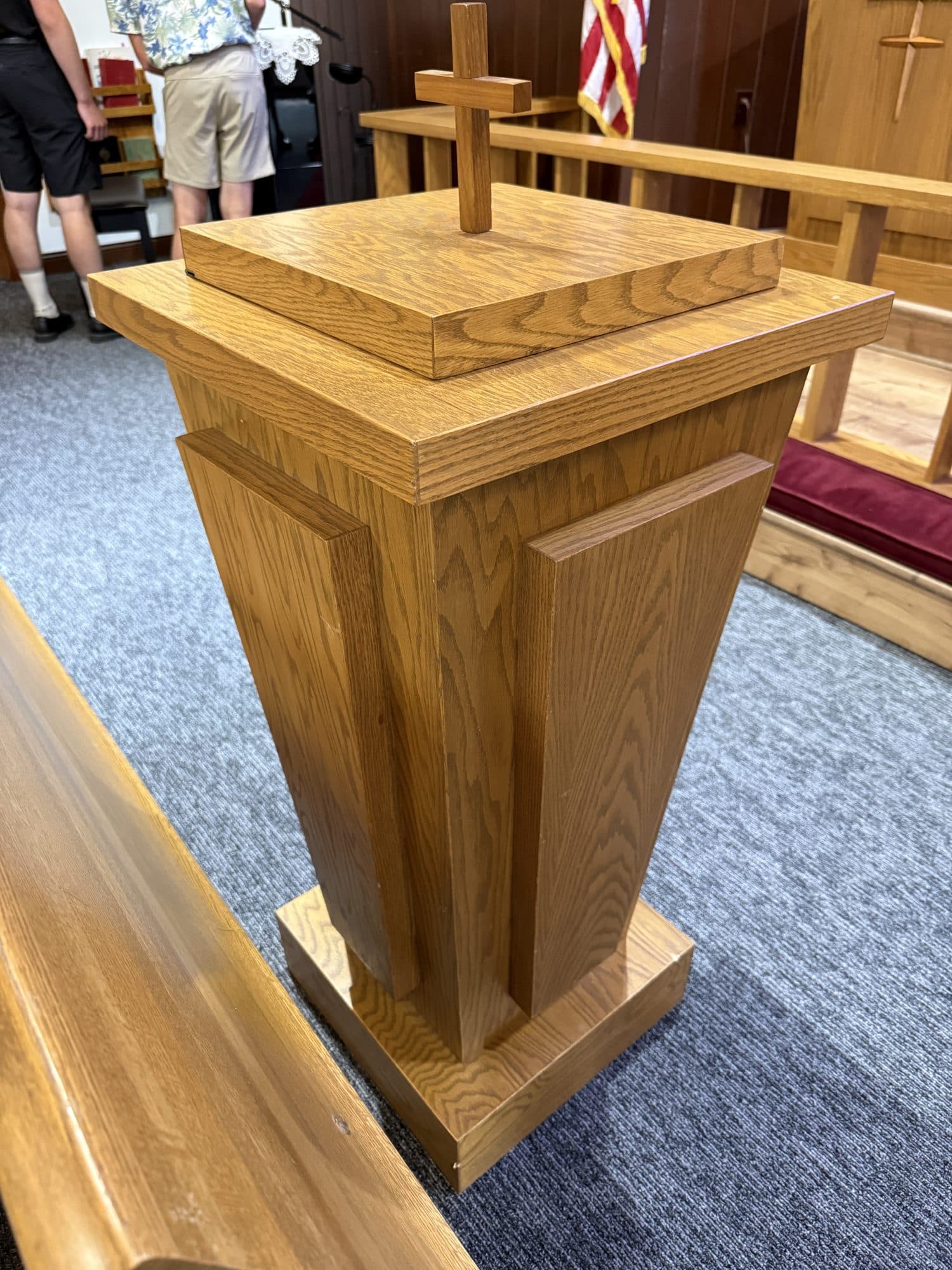 The oak baptismal font standing at the front of the nave